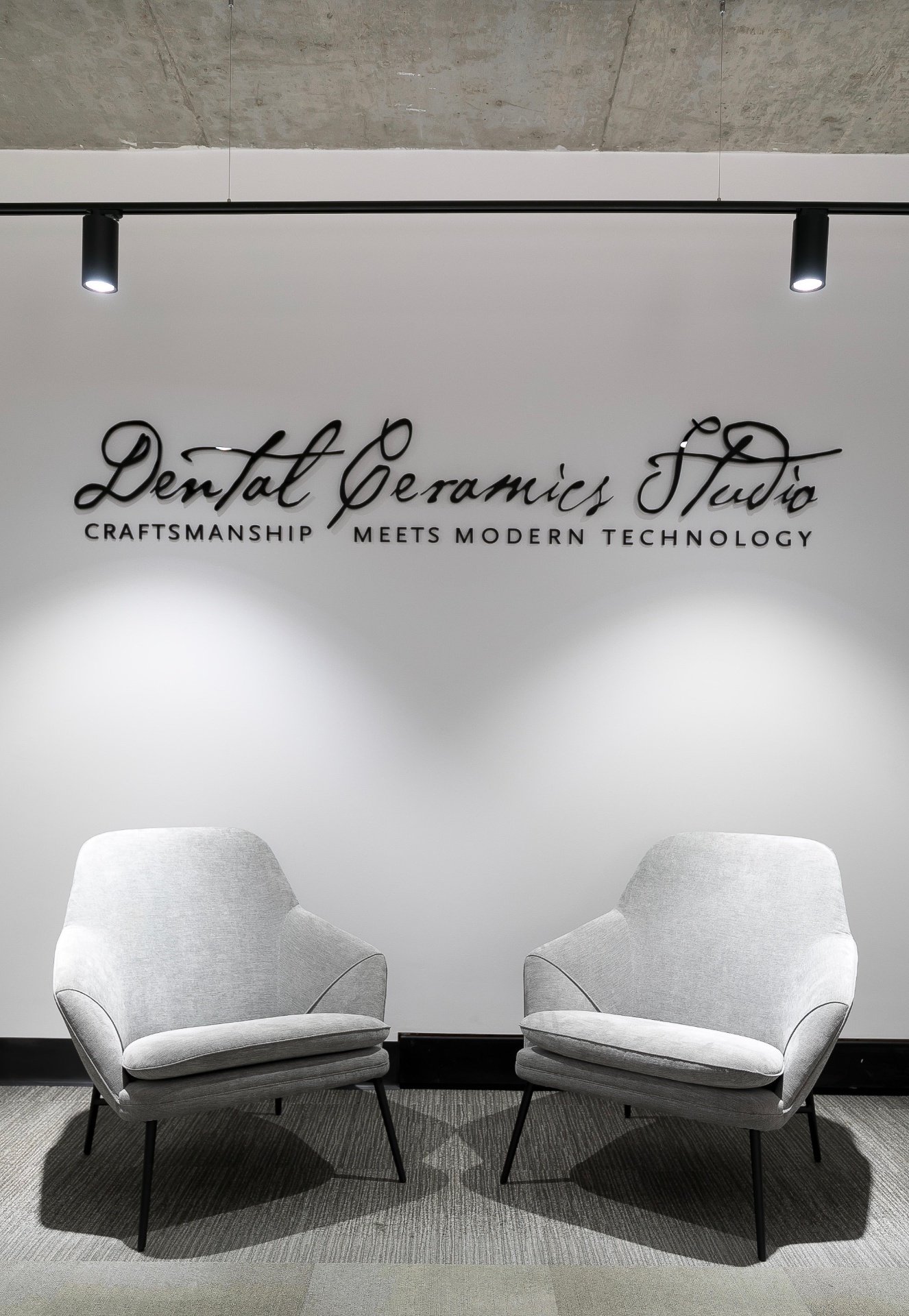 Dental Ceramics Studio signage above the reception seating area