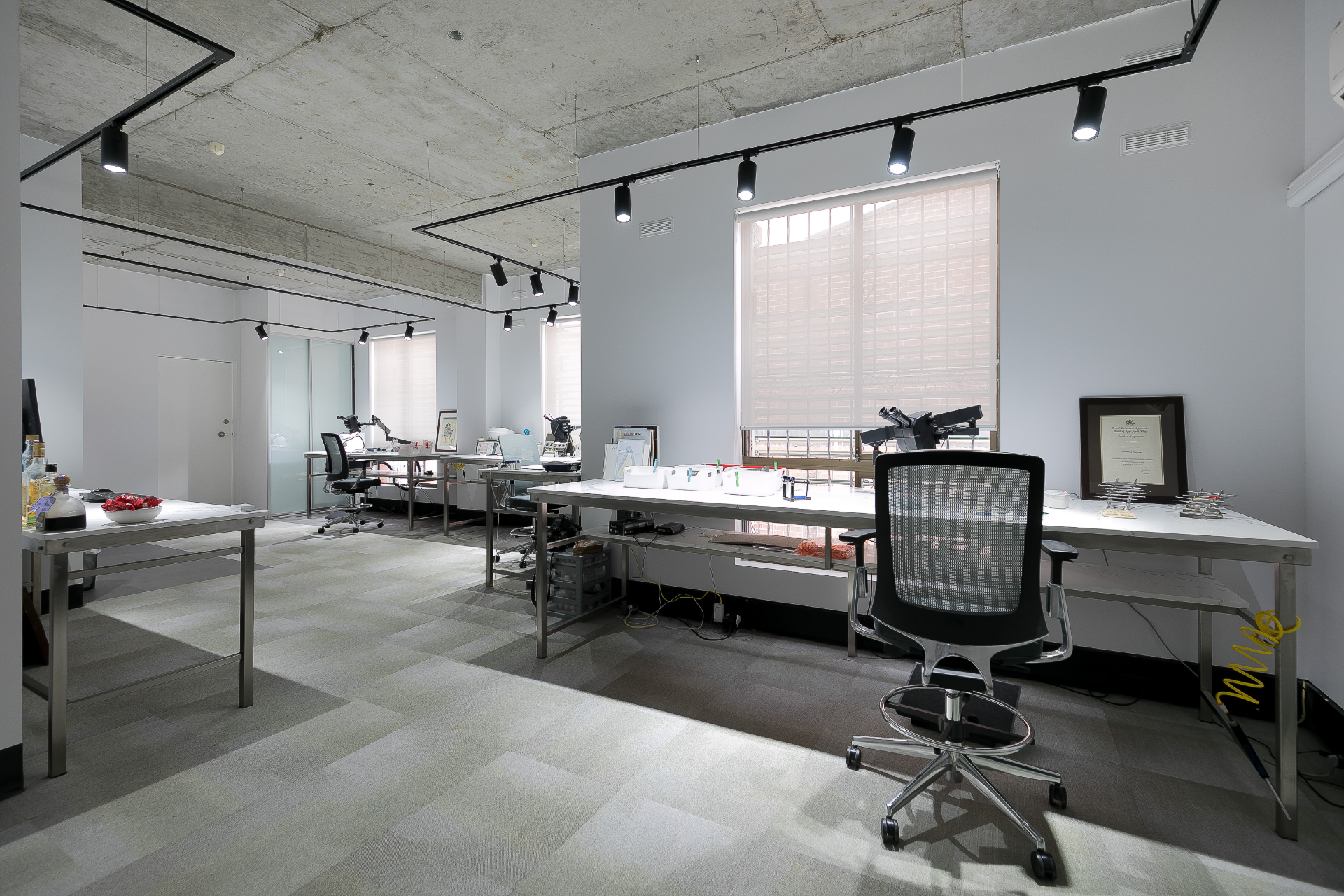 Ceramist benches with microscopes and natural light from the studio windows